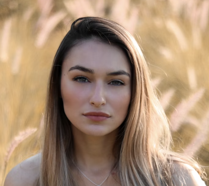 Woman in tall grass portrait